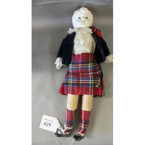 629 - Vintage Scottish Doll with White Porcelain Head, measuring approx 25cm tall.