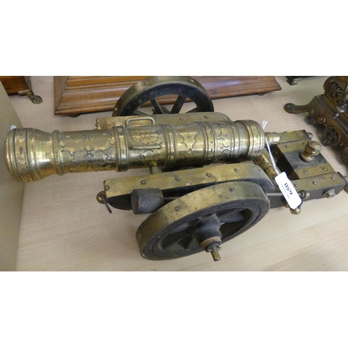 650 - Ornamental Brass Cannon.