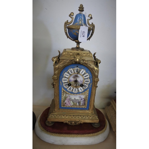 673 - French Gilt Brass Mantel Clock with Painted Porcelain Panels, Urn Shaped Finial, Decorative Chased B... 