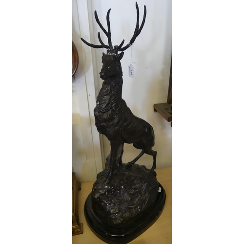 693 - Bronzed Cast Metal Red Deer Stag Supported on Rustic Base, measuring approx 75cm tall.