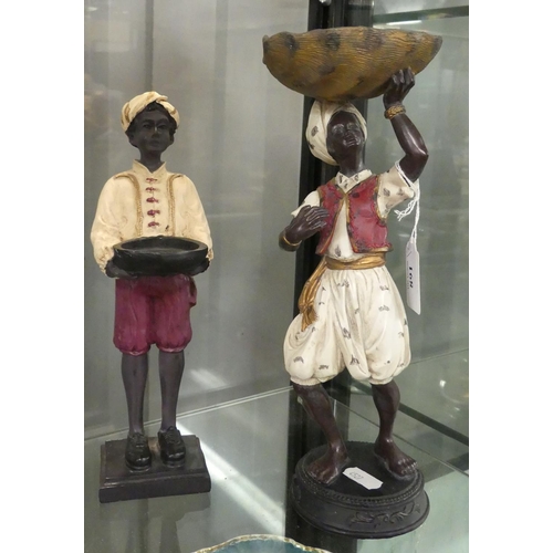 891 - Pair of Composite Figures in the form of Servants carrying Baskets.