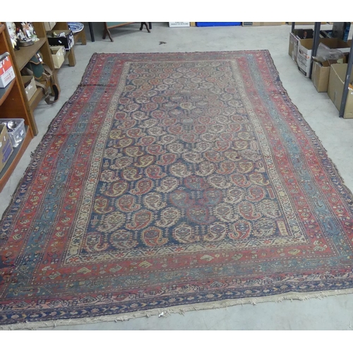 1669 - Large Antique Fringed & Bordered Wool Rug, measuring 180 x 324cm.