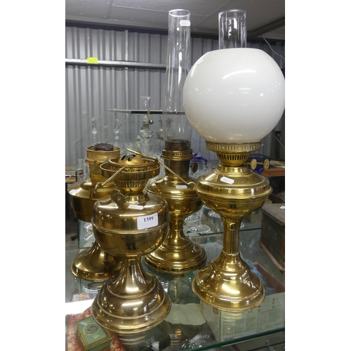 1399 - Four Brass Oil Lamps.