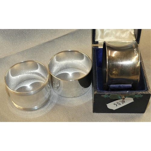 1523 - Three Odd Silver Napkin Rings (one in Case), weighing approx 3.5 oz troy.