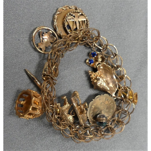 1842 - 10kt Gold Charm Bracelet - Various Gold Charms - total weight 42gms