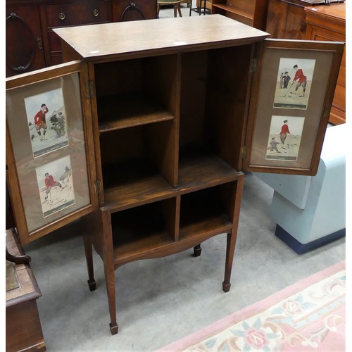 2293 - Edwardian Two Door Oak Cabinet - the door interiors mounted with Golfing prints by Edward G Fuller.