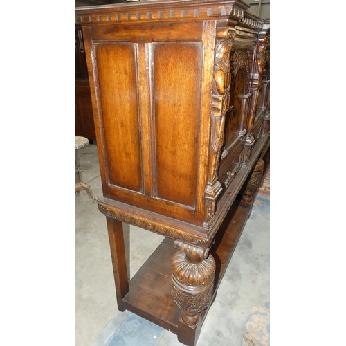 2890 - Carved Oak Inlaid Cupboard - Width 130cm x depth 48cm & Height 137cm.