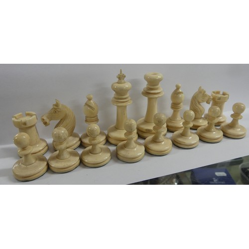 988 - Two Boxes of Stained Bone Chess Pieces.