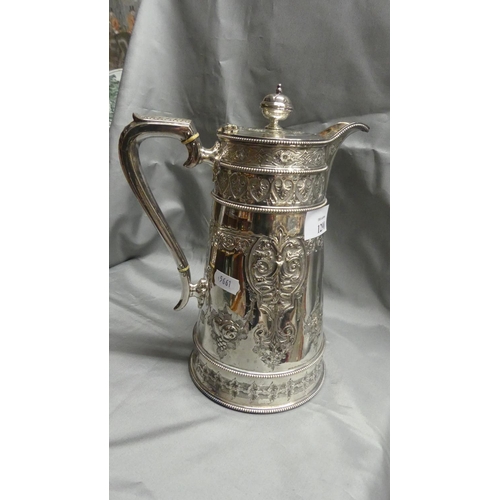 1290 - Large Silverplated Lidded Jug, Tapered Cylindrical Body embossed with decorative fruits and scrollin... 