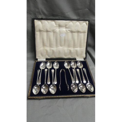 1299 - Cased Set of 12 Silver Plated Teaspoons & Matching Sugar Tongs.