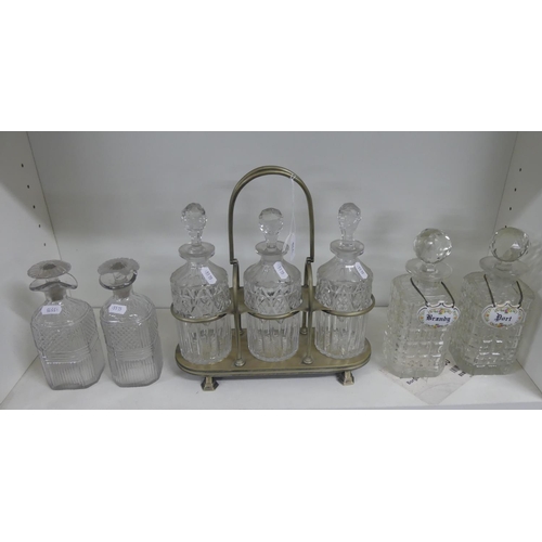 770 - Three Cut Glass Decanters with EP Stand & Two Pairs of Glass Decanters.