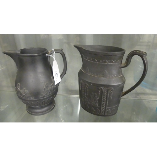 907 - Two Black Basalt Porcelain Jugs.