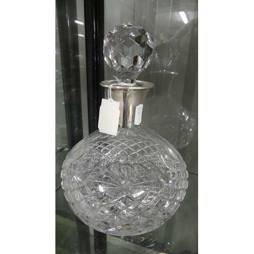 935 - Cut Glass Decanter with Silver Collar.