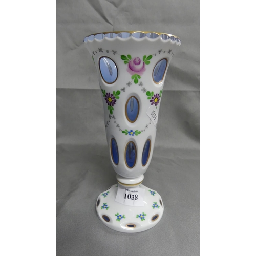 1038 - Bohemian Glass Footed Vase, opaque white body with oval windows, painted with flowers.