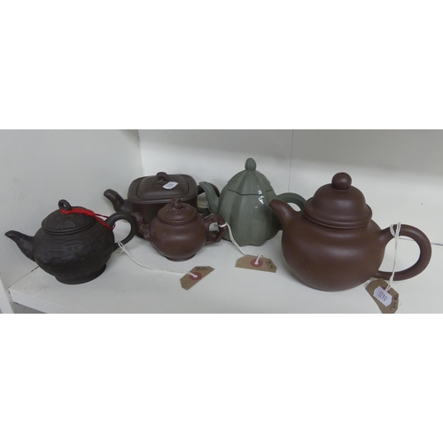 883 - Five Oriental Teapots - various sizes.