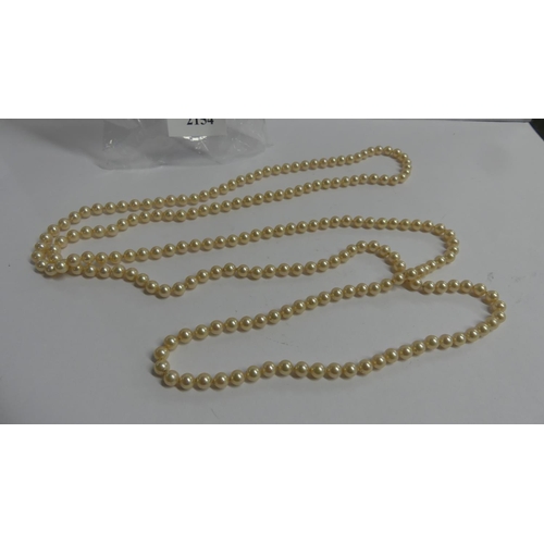 2154 - Long Strand of Simulated Pearls, approx 140cm long.