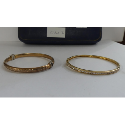 2161Z - 2 Silver Gilt Bangles - one gem set