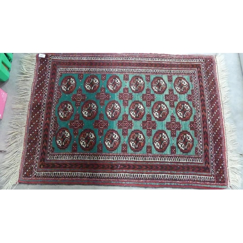 2558 - Small Eastern Fringed and Bordered Wool Rug, approx 78 x 110cm.