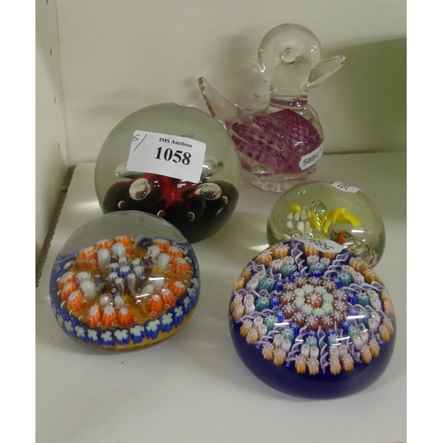 1058 - Five Assorted Glass Paperweights.