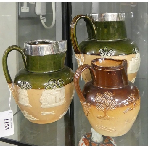 1153 - 3 Graduated Stoneware Hunting Jugs. (2 Largest Have London Silver Hallmark Rims).