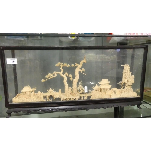 1184 - Chinese Carved Cork Diorama Village scene in a  Glass Case.
Measures 60 cm wide by 28 cm tall and 10... 