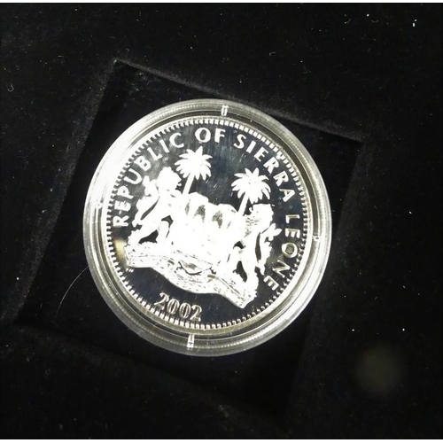 2073 - Case of Nine Silver Queen Mother 1900-2002 Commemorative Coins.