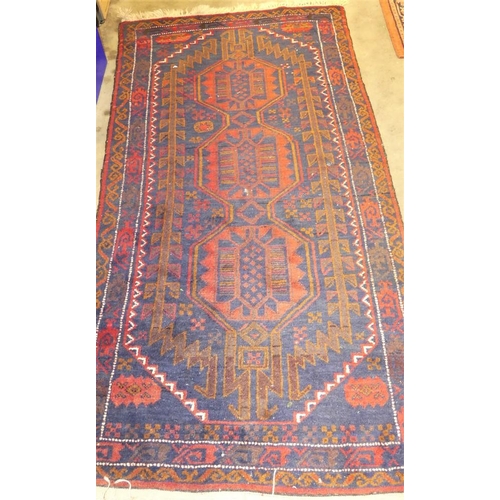 2276 - Eastern Fringed & Bordered Wool Rug, Red Ground with Lozenge Shaped Motif, approx 200 x 100cm.