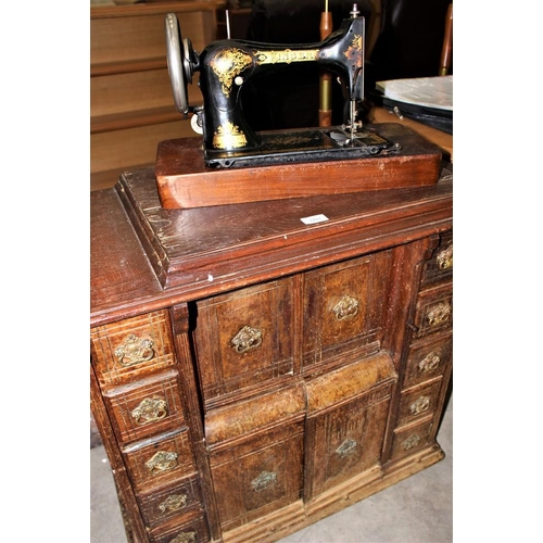 3211 - Singer Sewing Machine In Oak Cabinet