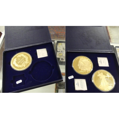 1428 - Two Cases - Three Oversized Gilded Liberty Dollar Coins.