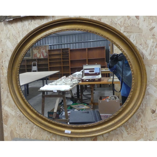 1449 - Large Oval Gilt Framed Wall Mirror, approx 88cm across.