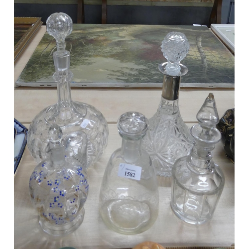 1582 - Five Assorted Cut Glass Decanters.