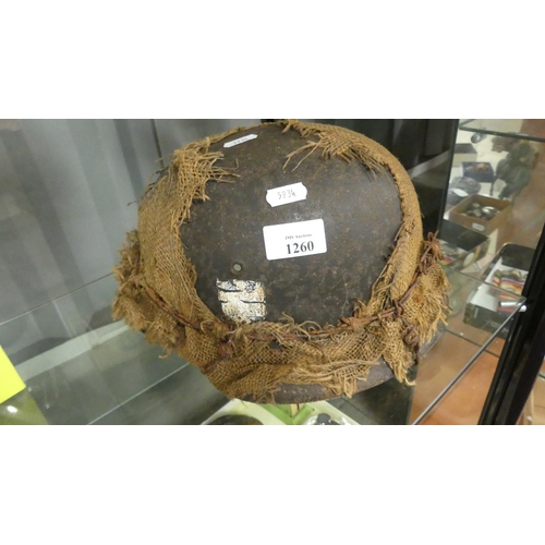 1260 - German WWII Helmet - Hessian Sacking Camouflage held in-place with a strand of barbed wire.