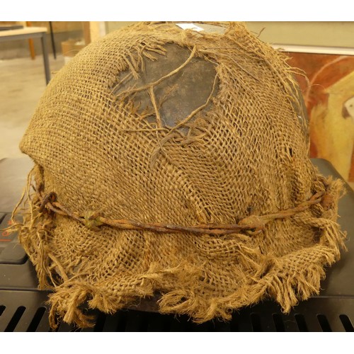 1260 - German WWII Helmet - Hessian Sacking Camouflage held in-place with a strand of barbed wire.