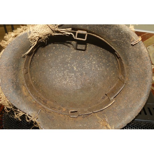 1260 - German WWII Helmet - Hessian Sacking Camouflage held in-place with a strand of barbed wire.