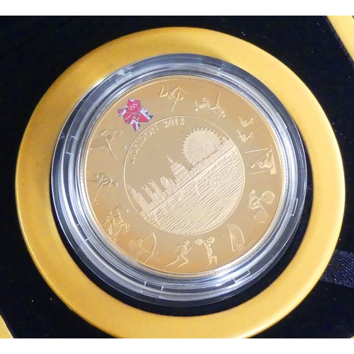 2156E - Cased UK Royal Mint London 2012 Olympic £5 Gold Coin - 531/5000, weighing 39.94g (0.9167 22ct). Comp... 