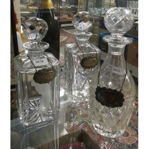 2078 - Three Cut Glass Decanters with EP Spirit Labels.