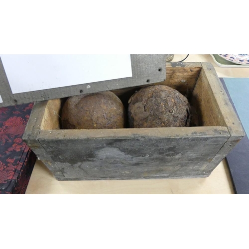 2188 - Two Old Peruvian Cannonballs in Wooden Case.