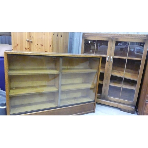 3010 - 2 Oak Glass Front Bookcases.