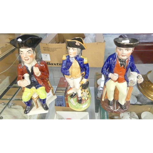 2052 - Three Staffordshire Antique Toby Jugs.