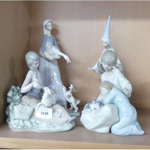 1048 - Four Lladro Porcelain Figurines.