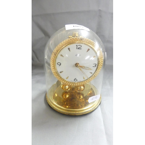 1069 - Vintage Koundo Brass Clock Under Glass Dome.