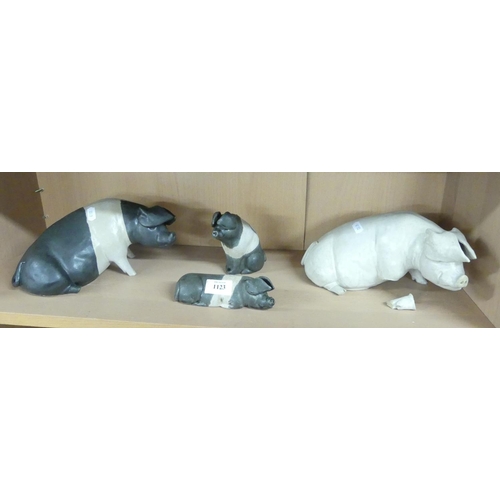 1123 - Four Karen Lainson Hand Sculptured Pottery Pigs.