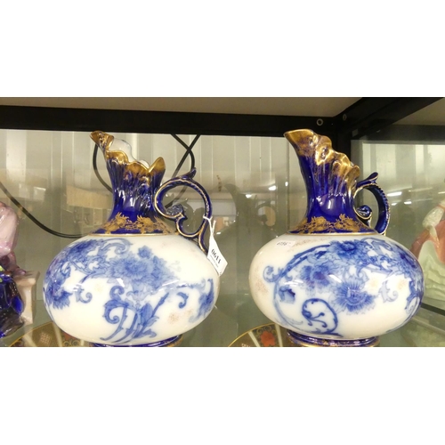 1190 - Pair of Victorian Flo Blue Pottery Ewers (One AF).