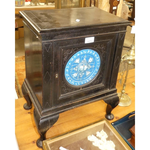 1476 - Late Victorian Ebonised Cupboard, the front door decorated with circular Ceramic Panel.