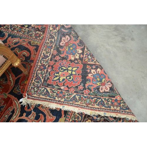 3345 - Very Large Persian Design Wool Rug, foliate shapes on a red ground within a deep border , approx 360... 