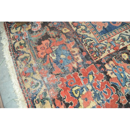 3345 - Very Large Persian Design Wool Rug, foliate shapes on a red ground within a deep border , approx 360... 