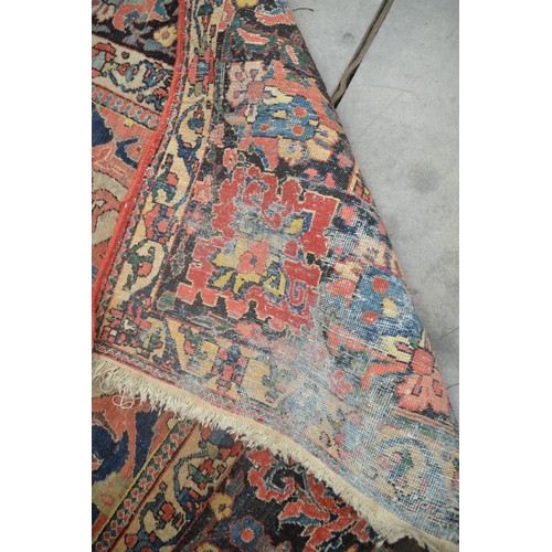 3345 - Very Large Persian Design Wool Rug, foliate shapes on a red ground within a deep border , approx 360... 