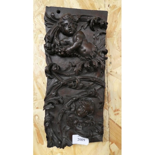 2009 - Heavy Hardwood Block Carved with Cherubs and Scrolling Acanthus, approx 14 x 31cm.