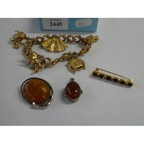 2445 - Gold Plated Charm Bracelet, Bar Brooch & Two Amber Pendants.