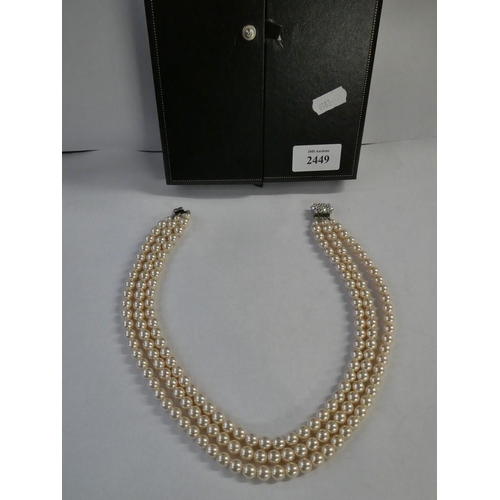 2449 - Triple Strand of Faux Pearls in Case.